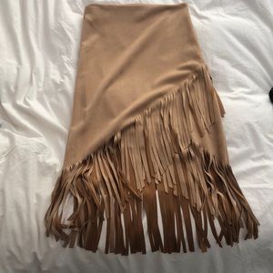 Aqua faux suede skirt with fringes. Never worn, small cut on one fringe